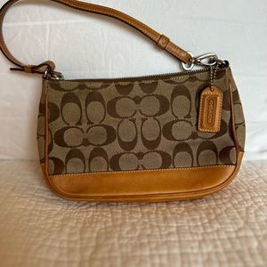 Small, genuine coach bag.